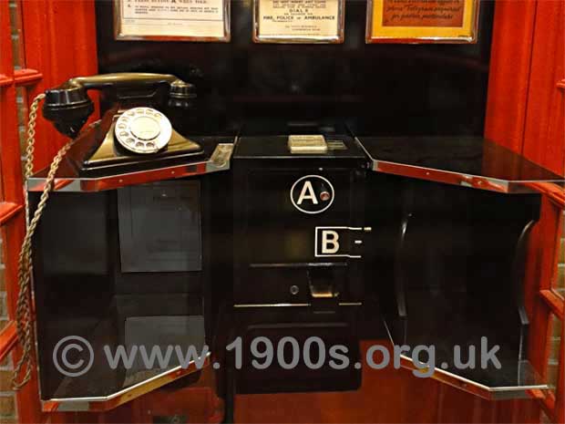 Inside a 1940s / 1950s UK public phone box showing the arrangement of the telephone, the coin slots, button A and button B.