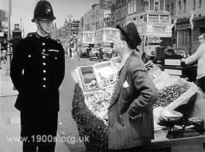 barrow boy selling goods from barrow
