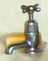 Tap of a wsah basin in a 1940s English suburban house