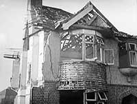 A bombed out house in 1940s war-time Britain