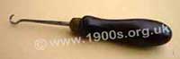 Old everyday button hook with a wooden handle