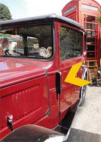 An old car showing its fold-out indicator closed down flat against the car body for driving along a straight road and not about to turn left or right