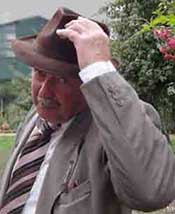 Man touching hat to a woman, a normal gesture in the 1940s and early 1950s, a left-over of doffing the hat