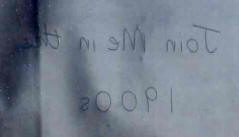  Underside of a used sheet of carbon paper showing 'mirror' writing