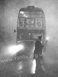 Lighting the way for a London bus in a fog/smog
