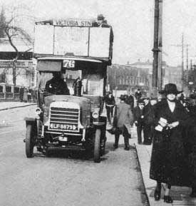 Open top bus and trolley bus in Fore Street, Edmonton, in the early 1900s