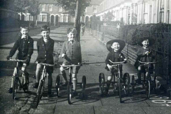 Huxley Estate, Edmonton, c1942 showing a house number with the St John's 
	ambulance cross painted on the pavement, the iron railings still in position prior 
	to removal for the war effort and the complete absence of cars.