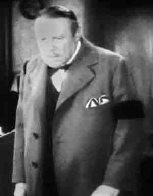Man wearing a black armband, the symbol of mourning in early 1900s Britain