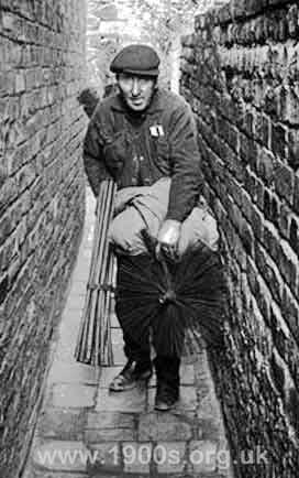 Early 1900s chimney sweep with his brushes, sacks, and cloths