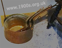 Tarnished copper saucepans