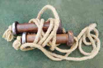 Early 1900s superior skipping rope with wooden handles containing ball bearings to prevent the rope from twisting out of shape as it swung round